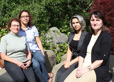 Bellevue College GED instructor Barbara Wright (left) sits next to student Iris Garcia while ESL student Azadeh Yazdani sits next to ESL instructor Marcela Pop. LINDSAY LARIN