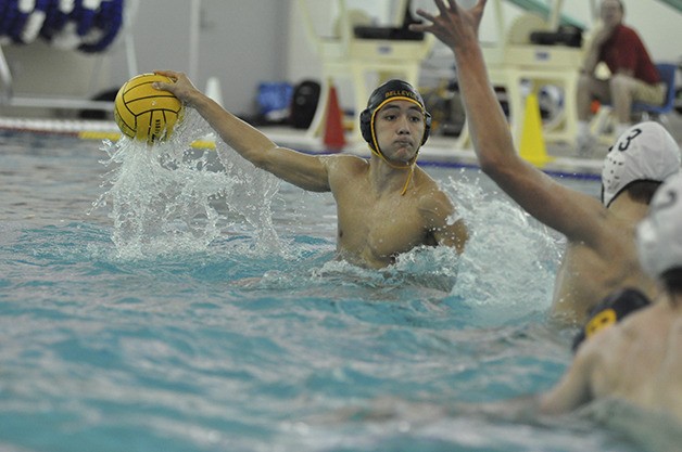 Bellevue co-captain Liam Naughton looks for a teammate to pass the ball to during an early season matchup.