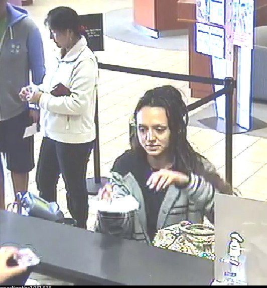 Bellevue Police are attempting to identify the woman in this still grab from security footage at the Aurora North Bank of America branch in Shoreline. The woman is alleged to have forged and cashed a check stolen from a residential mailbox in Bellevue.