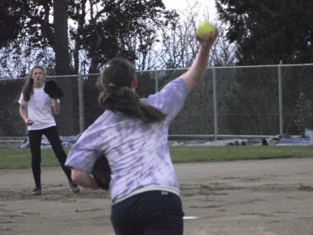 Bellevue softball players work on defensive drills during practice.