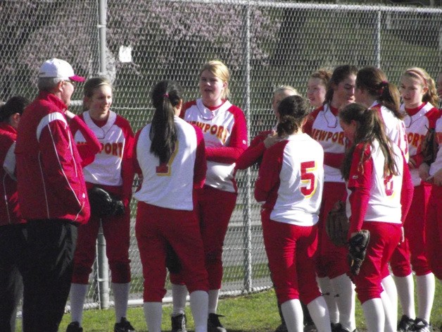 Newport players and coaches gather before a game against Interlake.