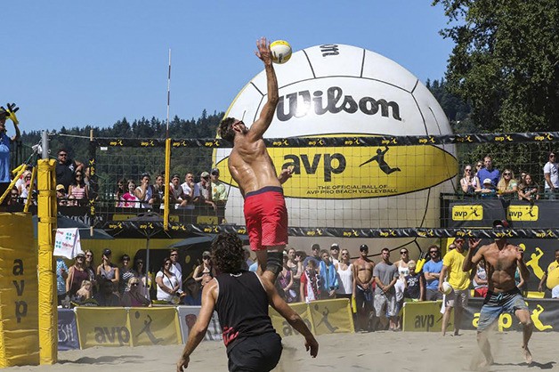 Ryan Doherty smashes the ball at its highest point during the finals of the AVP Kingston Seattle Open on Aug. 9 on Lake Sammamish State Park. The combo of John Mayer and Doherty