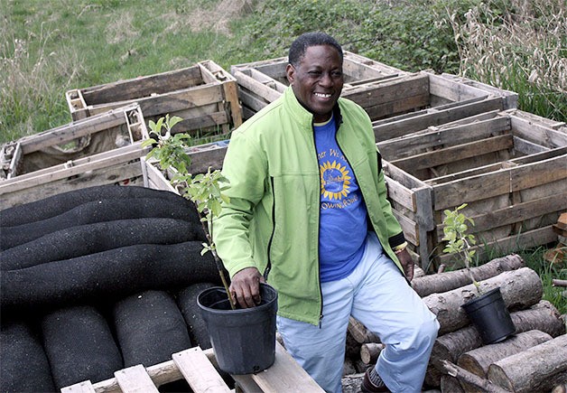 Urban farmer Maybin Chisebuka stands among the supplies that will be used to grow a 2.75-acre parcel of land in the Lake Hills Greenbelt into a hybrid garden for education and social business promotion.