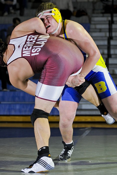 Wolverines Jimmy Trull goes for a takedown against Islander T.J. Blackburn during the WIAA 3A Region I wrestling final at Liberty High School in Renton on Saturday. Trull won the 215 pound class on points.