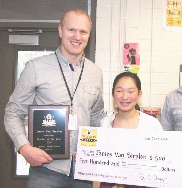 Chinook Middle School teacher James Van Stralen stands next to student Amelie Heise