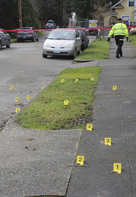 This photo taken during an investigation into the March 2012 shooting death of Russell Wilson by Bellevue SWAT members shows evidence cards placed where numerous bullet casings were found.