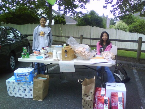 Youth volunteers participate in a food drive for people and pets in the Forest Ridge community on June 26.