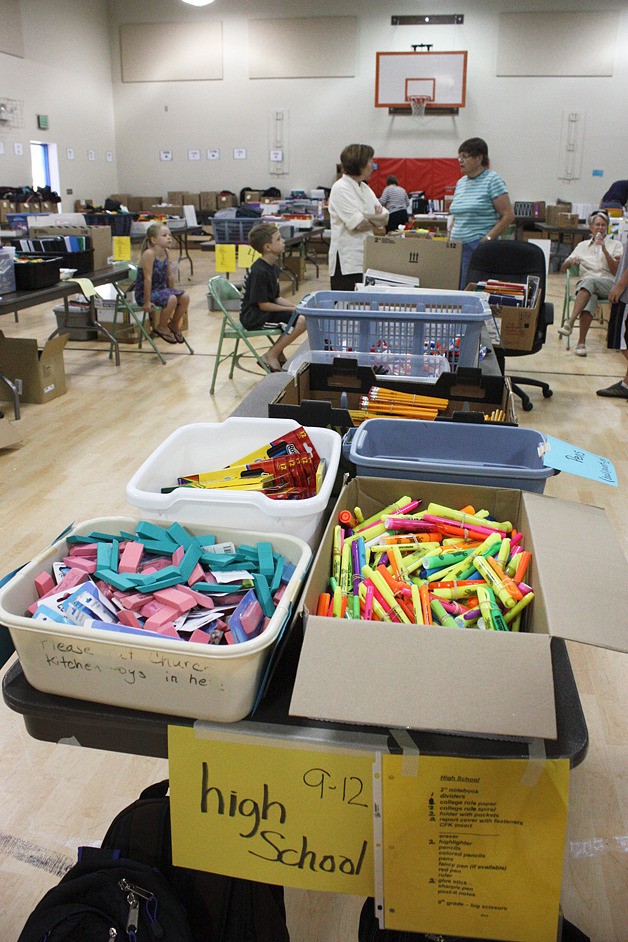 Volunteers gathered at Stevenson Elementary on Wednesday to assemble back to school packs.