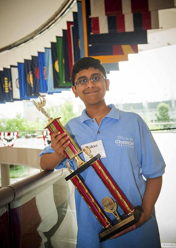 Eshan Kemp hold his first place trophy after winning the 2013 National 'You Be The Chemist' challenge in Philadelphia.