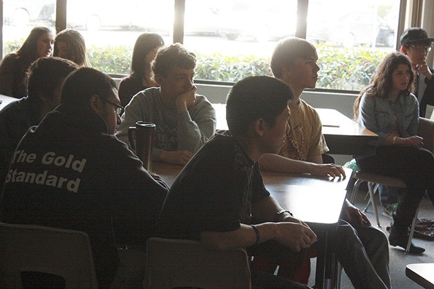Seniors watch a video overviewing the Spring District during International School's Focus Week.