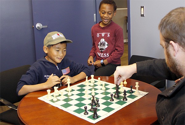 Bellevue Reporter’s Josh Stilts attempts to survive a chess match against two of the world’s best young players; Jason Yu