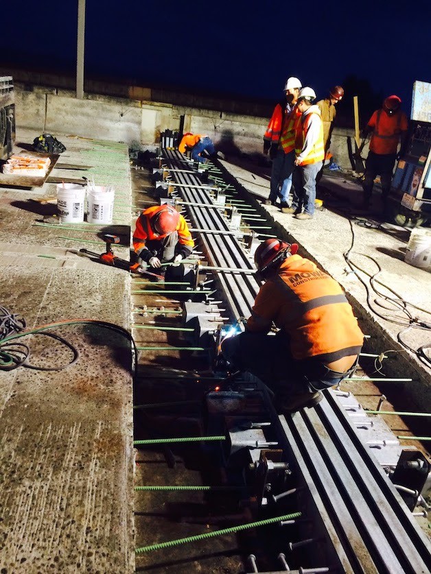 Contractor crews replace half of two of the huge expansion joints on I-90 at the East Channel Bridge as of Sunday morning.