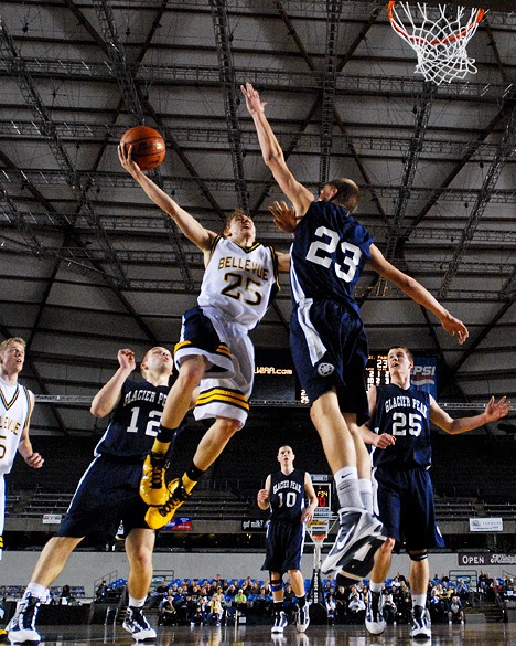 Wolverine Will Locke (25) drives to the basket for two points against Glacier Peak at the Tacoma Dome on Saturday.