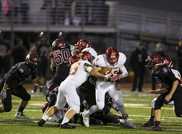 Newport running back Kenny Lafayette battles for extra yards on the ground against the Eastlake defense on Oct. 2 in Sammamish.