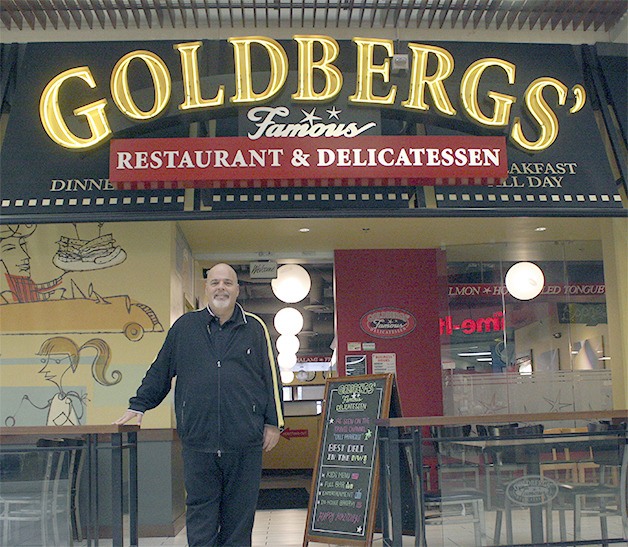 Benny Cukier welcomes customers to his Factoria delicatessen