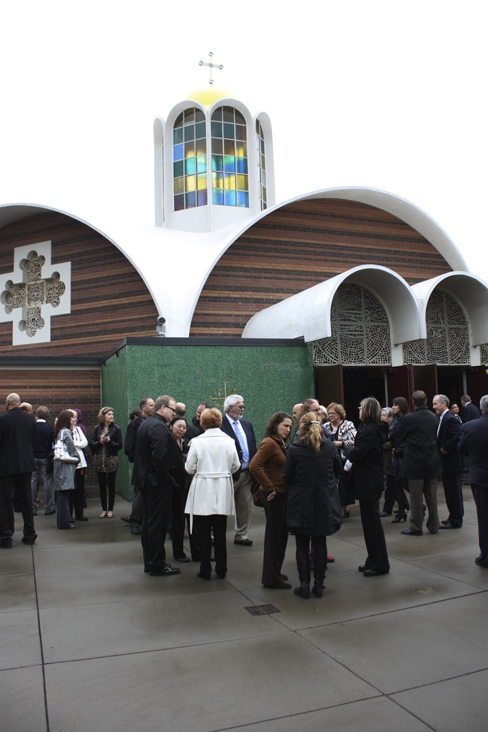 Attendees gather outside St. Demetrios Greek Orthodox Church in Seattle following the services honoring Gloria Leonidas.