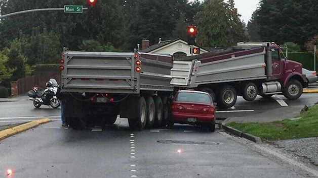 A car reportedly didn't take into account this narrow-turning construction dump truck while attempting to make a right-hand turn from southbound 110th Avenue Northeast to westbound Main Street on Oct. 22.