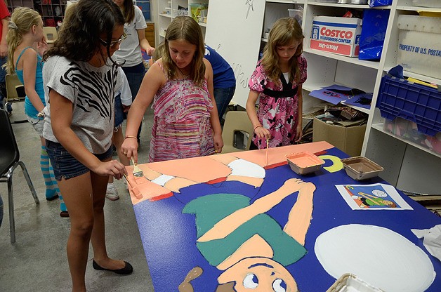 Children paint panels in the art room at the Boys and Girls Club Headquarters in Bellevue.