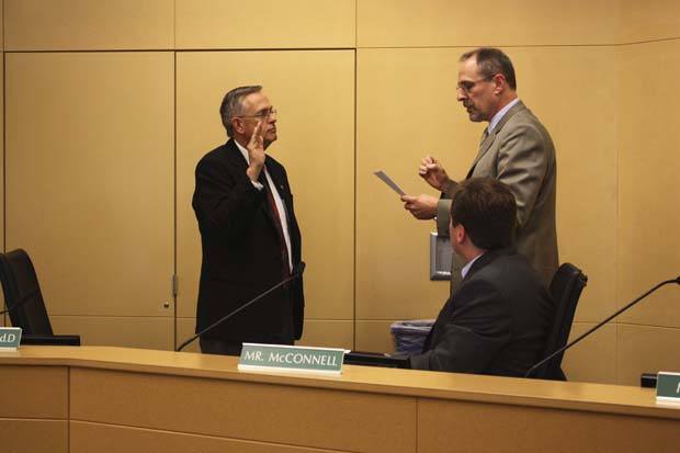 Dr. J. Tim Mills is sworn in as the new superintendent of the Bellevue School District on Tuesday