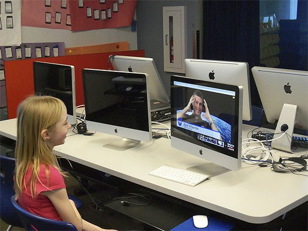 Open Window sixth grader Sydney Vernon discusses her 3-D printer design for a space planter with former NASA astronaut Reid Wiseman.