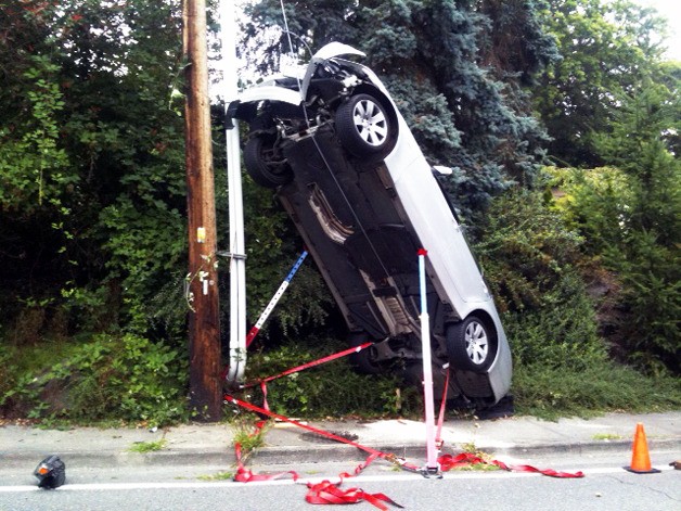 A car ended up stuck on the guide wire of a utility pole Friday after steering too far to the right to avoid traffic.