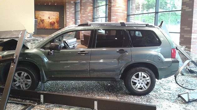 Bellevue Police say failure to yield the right of way at the Hyatt Regency Bellevue resulted in a two-vehicle collision that directed an SUV through the glass doors of the upscale hotel on Wednesday night. No one was injured.