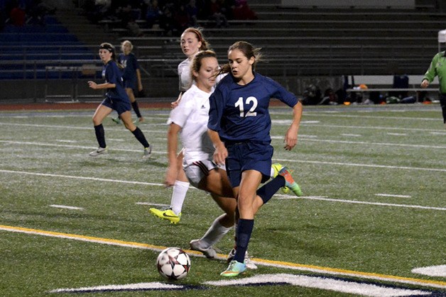 Forward Jojo Harber dribbles past a defender in a game earlier this season.