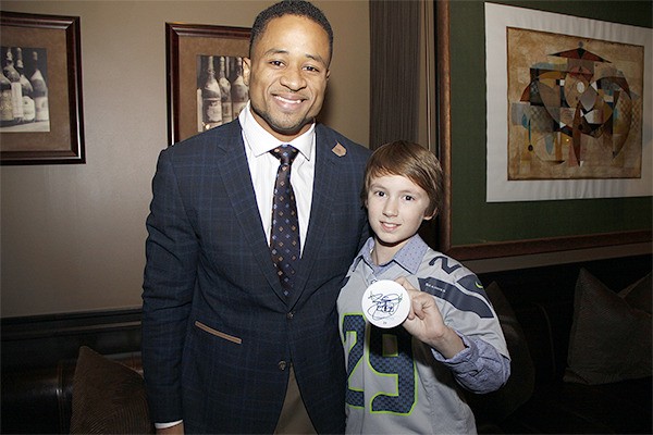 Seahawks All-Pro safety Earl Thomas III stands with one of his biggest fans