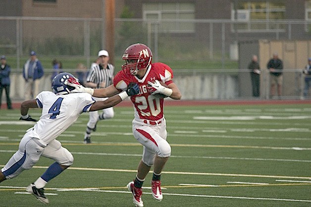 Newport running back Neil Hones brushes off Bothell's Jared Berry during Friday's 28-24 win.