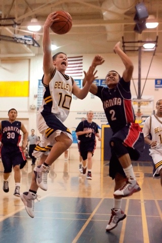 Bellevue's Cam Warren drives to the hoop in the Wolverine's win over Juanita.