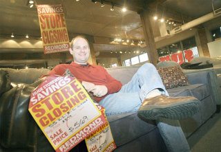 Josh Underhill sits in the showroom of one of Underhill's stores on Wednesday