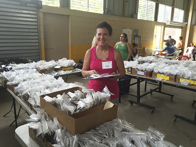 Mary Baker stands with the many supplies she and other optometrists brought on their trip to El Salvador earlier this year. Members of the public can donate used eyeglasses off for reuse at Baker’s office in the Overlake neighborhood.
