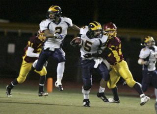 Bellevue's Peter Nguyen collides with Capital's Collin Milligan as Jamal Atfau