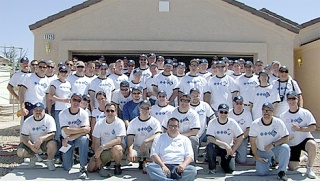 Employees of UC4 in Bellevue helped build four homes for Habitat for Humanity while in Las Vegas for a meeting.