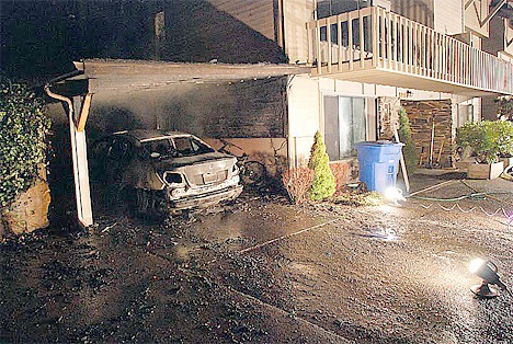 Fire destroyed a car and damaged a carport in Bellevue on Tuesday