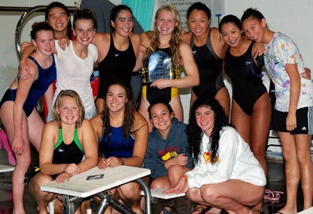 Members of the Newport swim team celebrate their KingCo league meet championship win.
