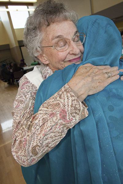 Two members of Cultural Conversations hug during one of the many meet-ups held throughout the year. For participants