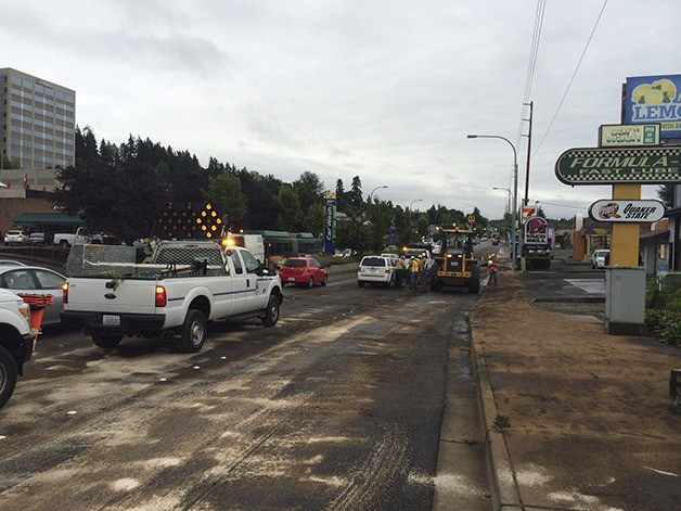 Overnight flooding in Factoria caused oil to run off from Formula-1 Fast Lube and onto Factoria Boulevard Wednesday. Crews are out cleaning the spill.