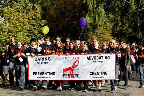 Students from Newport High School's APSEN club hold the Seattle AIDS Walk banner at the beginning of last year's event