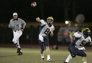 Bellevue's QB Tommy Castle throws the ball during the semifinal game Monday