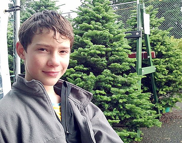 Dmytro Banin is one of many members of Scout troop 626 who sell Christmas trees each year in Newport Hills.