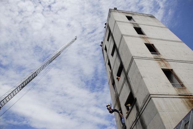 Campers rappelled from a four-story building and climbed a 100-foot fire truck ladder during drills at the Bellevue Fire Training Center as part of Camp Blaze Tuesday