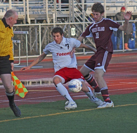 Sammamish's Mitchell Rock is knocked down by Mercer Island defender Ari Langman during Tuesday's game.