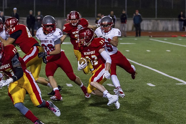 Knights' running back Paul Wells battles for extra yardage against the Mount Si Wildcats defense on Oct. 24 in Bellevue.