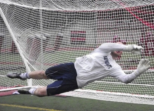 Sammamish keeper Stuart Ellsworth dives to make a save during practice