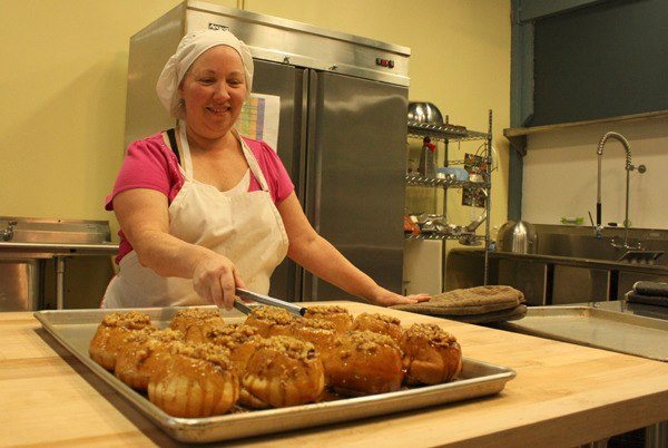 Linda Hays of Forest Fairy Bakery prepares sticky buns. A family owned operation