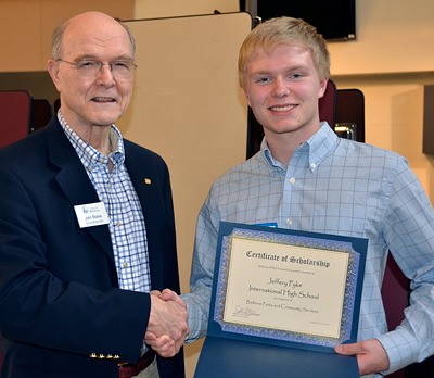 Bellevue City Councilman John Stokes congratulates Jeffrey Pyke with the Bellevue Parks and Community Services Scholarship.