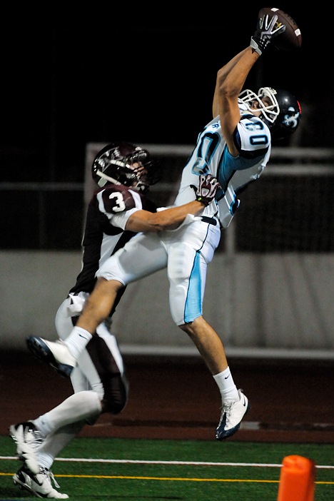 Saints WR Bobby Mueller (80) makes a catch for a two-point conversion over Islanders DB Ben Emmanuels (3) at Mercer Island on Friday. Interlake won a 51-45 shootout at Islander Stadium.