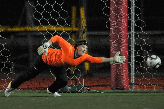 A penalty kick shot gets past the outstretched arm of Wovlerine goal keeper Lisa Bennet in loss at Juanita on Wednesday.