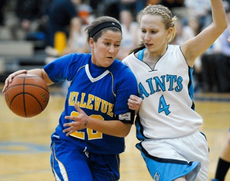 Kelly Meggs drives to the hoop against Interlake's Chandler Smidt in Friday's 62-41 Bellevue win.